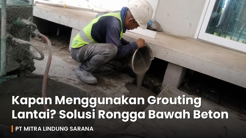 Pekerja menuangkan grout untuk mengisi rongga di bawah pelat beton