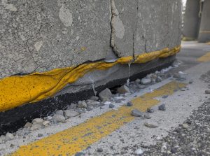 close-up shot of a failed expansion joint on a bridge