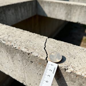 hairline crack on a concrete beam