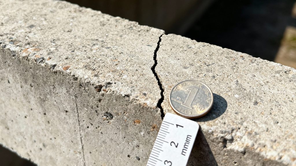 hairline crack on a concrete beam